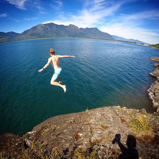 A student cliff diving in Chile