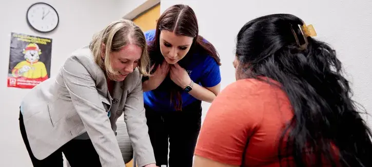 Jessica Goodman, PT, DPT, PhD with student and patient