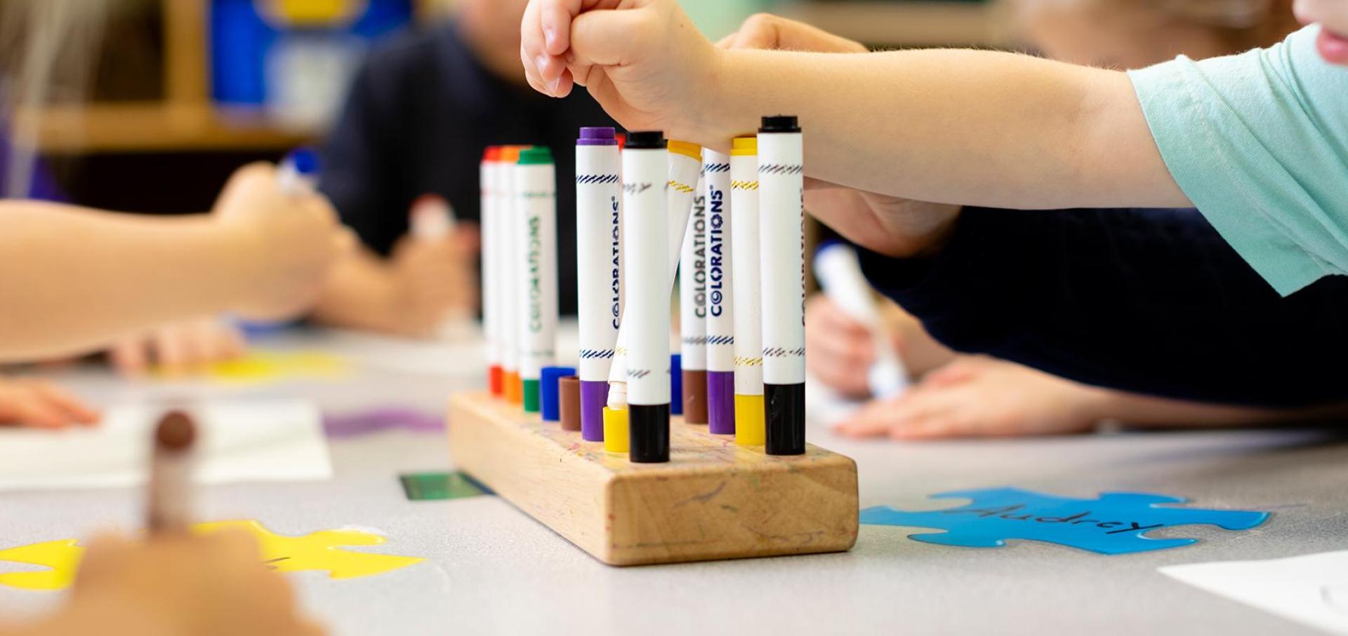 Children using markers.