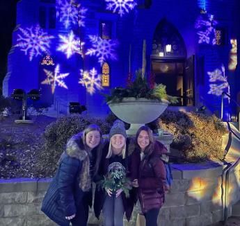 Eva Tersteeg and friends in front of St. John's Church at Christmas