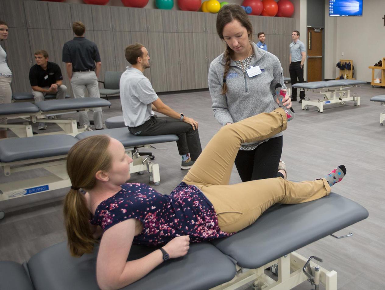 Physical Therapy student working with patient