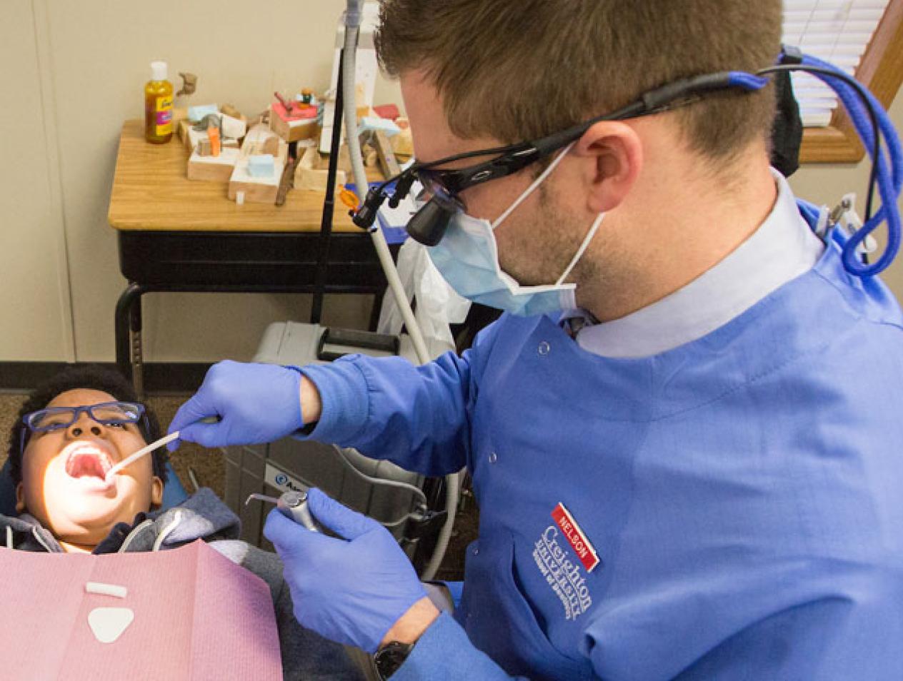 Creighton Dentistry providing dental care to patient in the community.