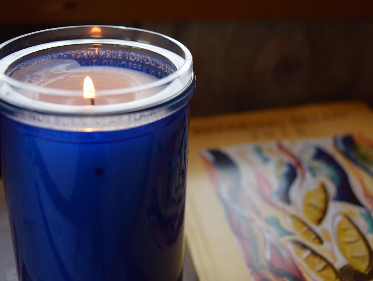 A candle and a Christian spirituality book