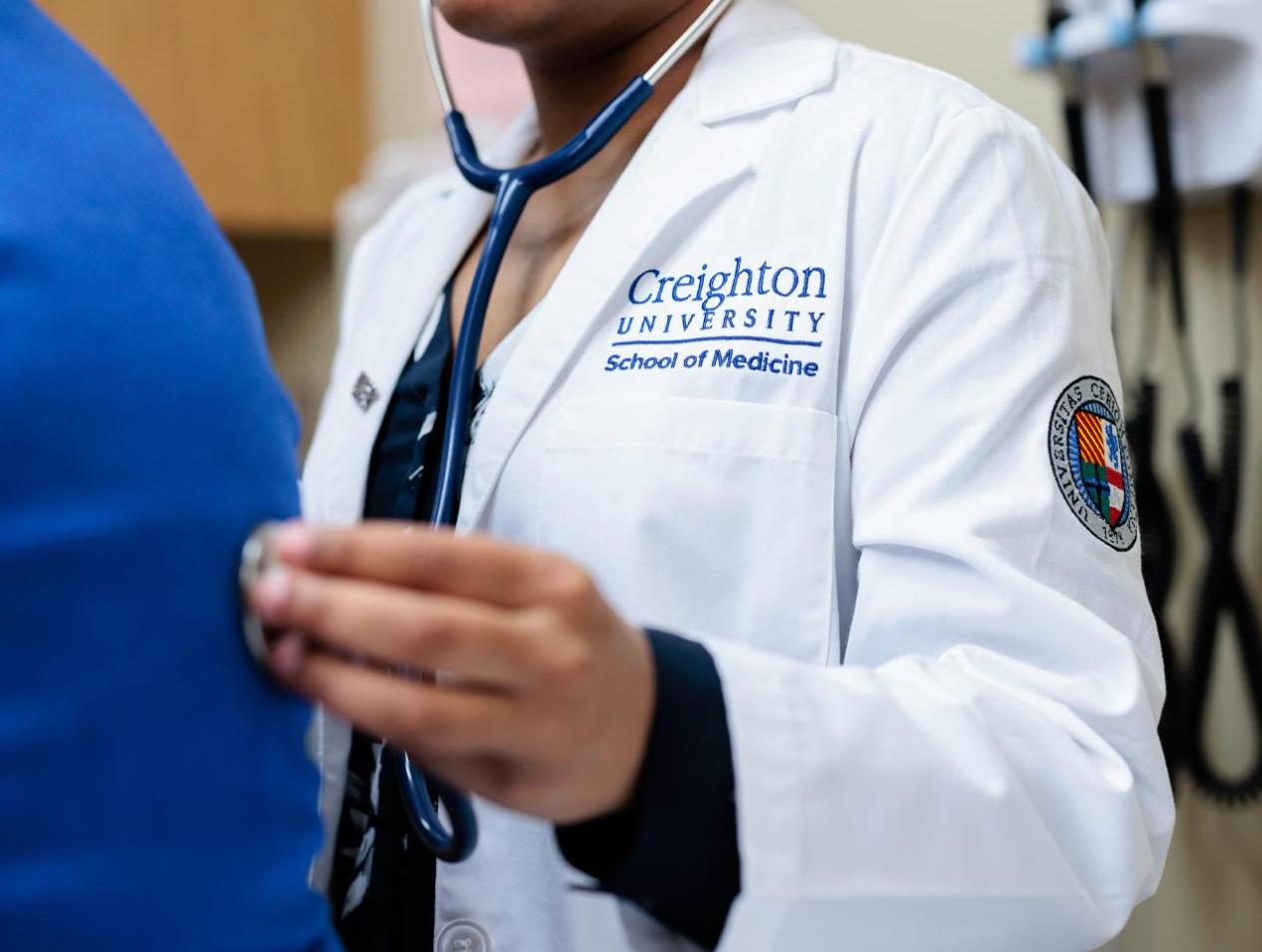 Medical student using stethoscope