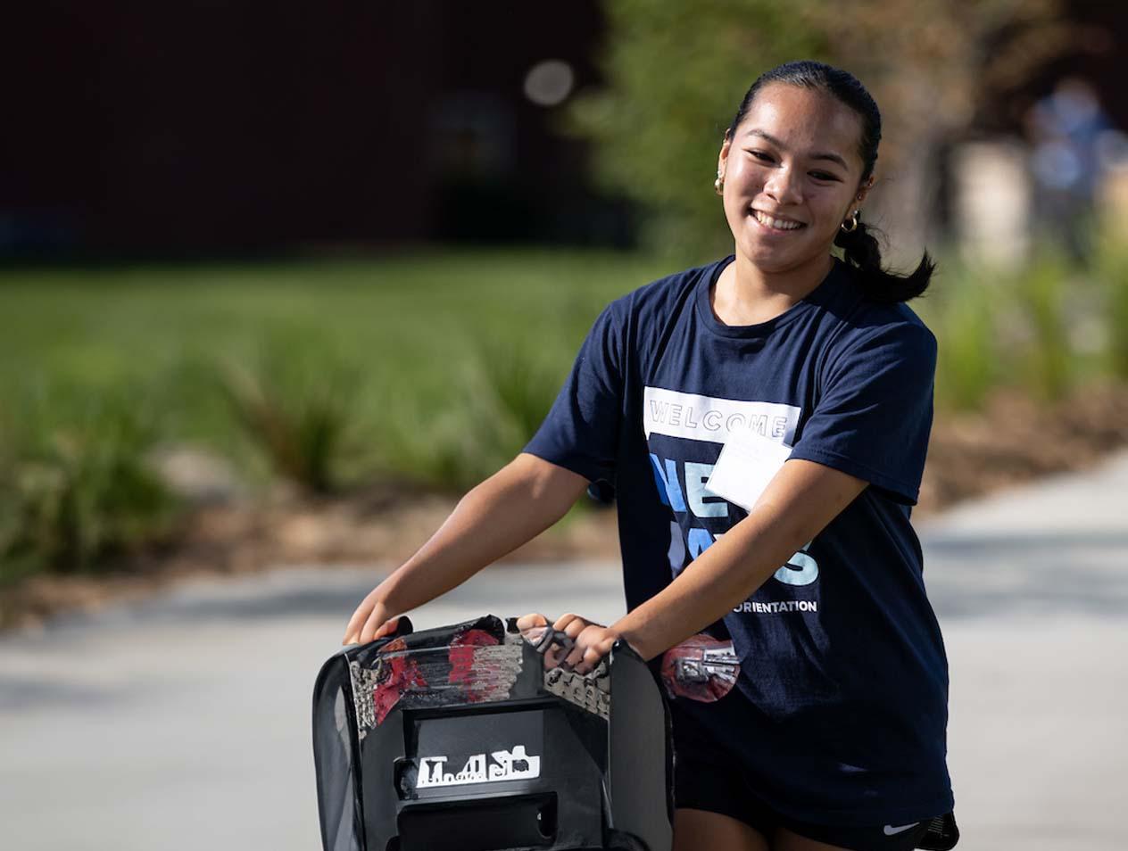 Diverse student moving in to residence hall.