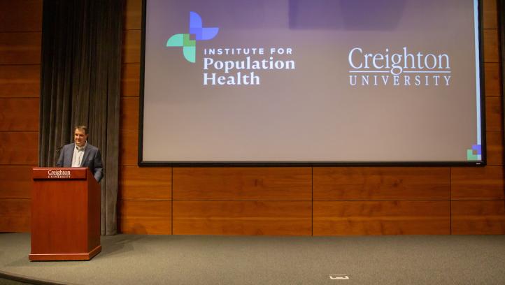 Scott Shipman welcomes attendees to Creighton's Institute for Population Health Symposium