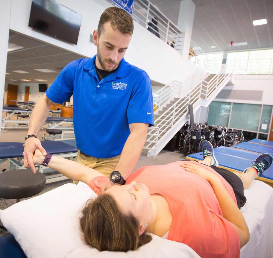 Physical Therapy student and faculty in classroom
