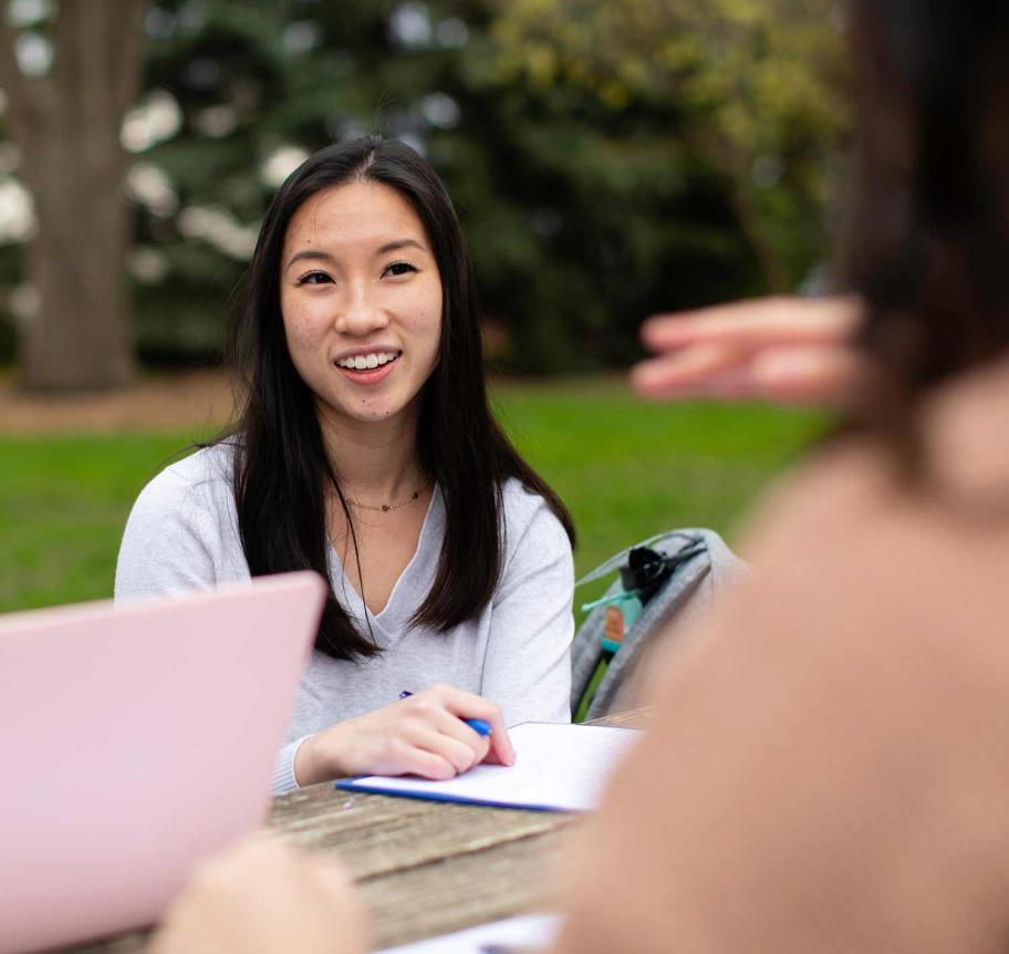 Female students in discussion outdoors