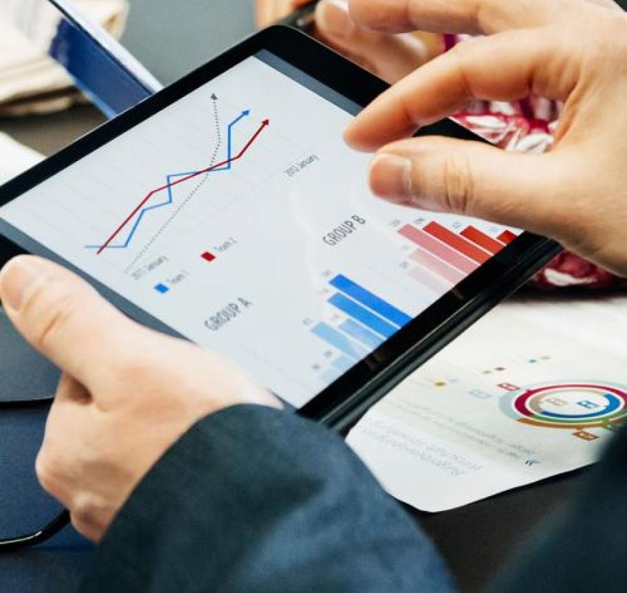 Financial charts being viewed on a tablet