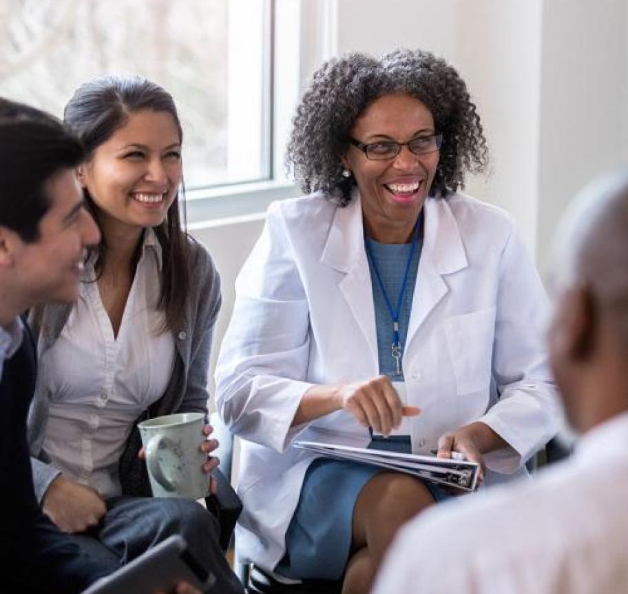 Healthcare professionals sitting in a group while talking