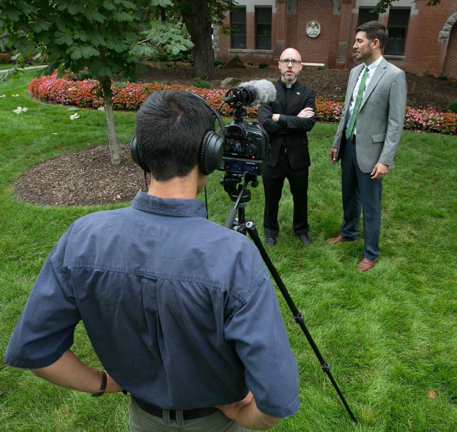 Filming on campus with a Jesuit faculty member