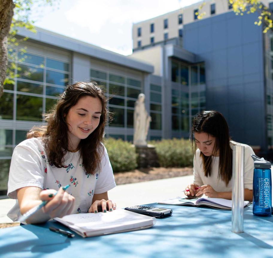 Students studying outdoors on Creighton campus