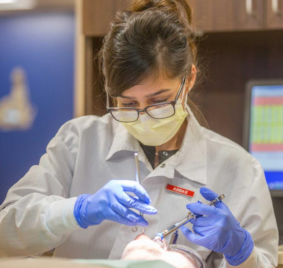 Dentistry student working in Creighton Dental Clinic