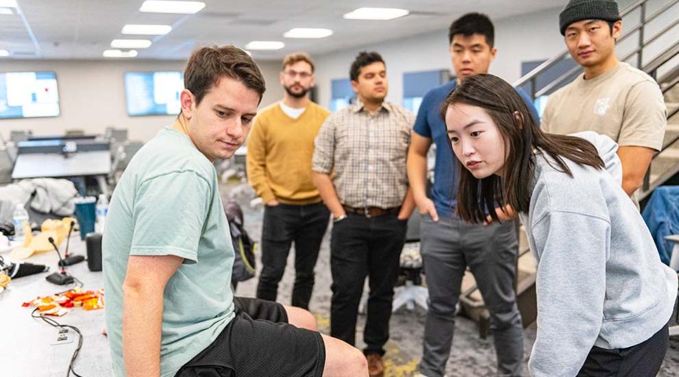 group of diverse medical students looking at computer