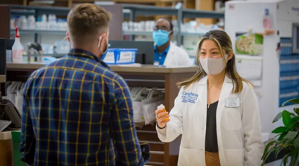 pharmacist giving meds