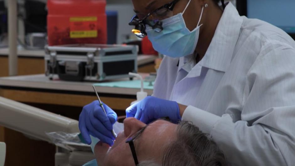 Dentist performing procedure on patient