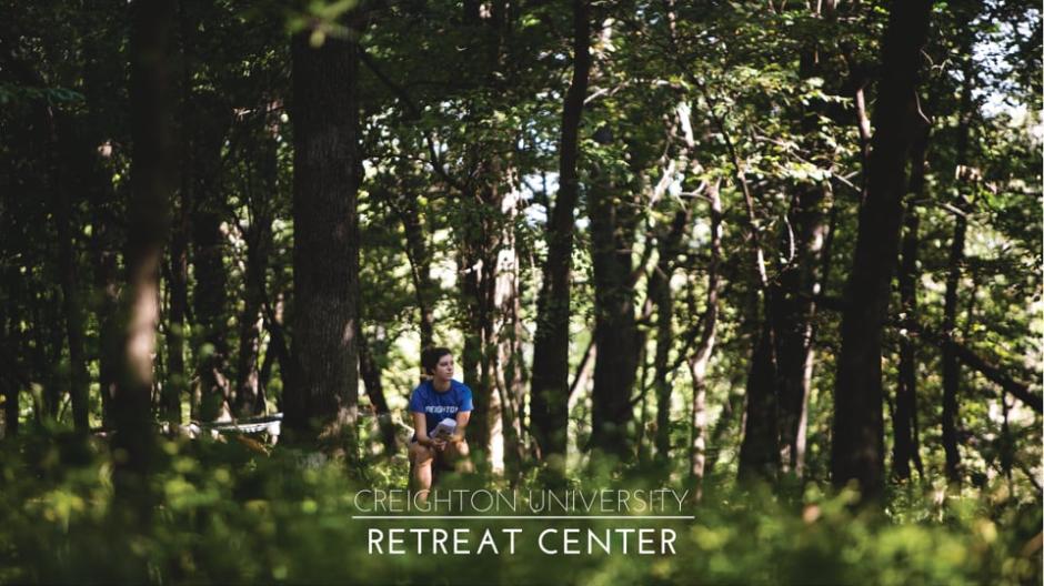 Video thumbnail featuring a retreat participant sitting in the woods