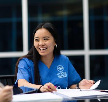 Nursing student smiling while studying