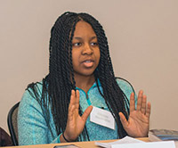 A student talking during an Institute for Economic Inquiry reading group