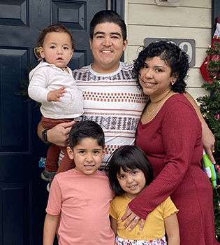 Rojas-Chavez with her husband and three children.