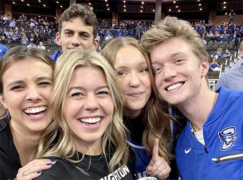 Abby Kleespie at Creighton basketball game with friends.