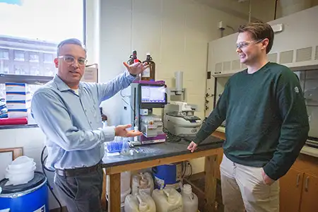 Fletcher working with student on research.