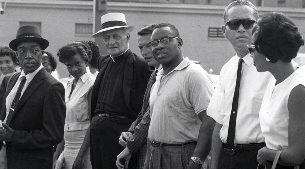 Fr. Markoe with members fo the the Omaha DePorres Club