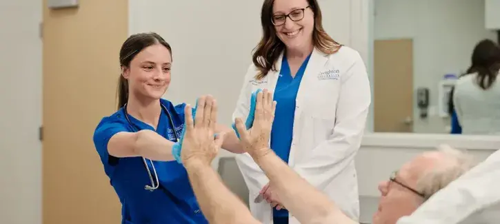 Nurse celebrating with patient.