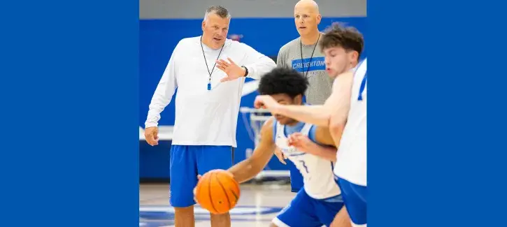 Greg McDermott and Alan Huss coaching basketball practice