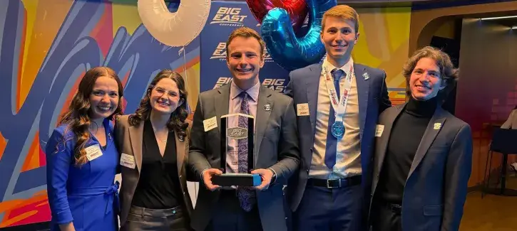 Creighton BIG EAST team photo with trophy.