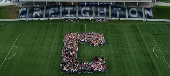 Creighton stadium with new students congregated into the letter C.