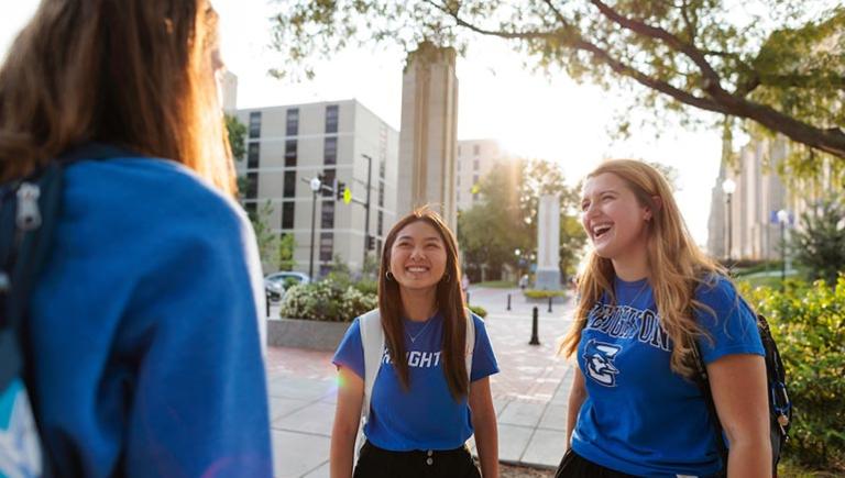 students on the mall wearing Creighton shirts