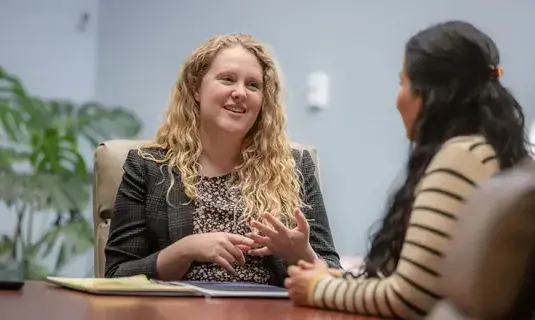 Consulting about bankruptcy in office setting.