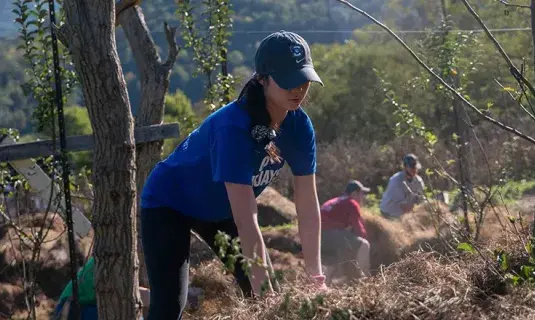 Student working in their community.