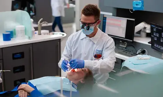 Working on patient in dental clinic.