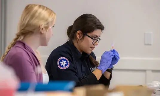 Paramedic training with gloves.