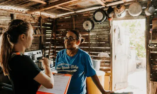 Student interviewing community member in the Dominican Republic.