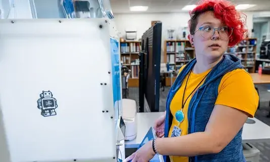 Student participating in emerging technologies workshop.