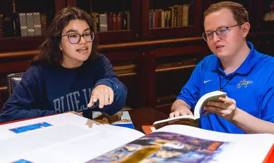 Students consulting collections publication.