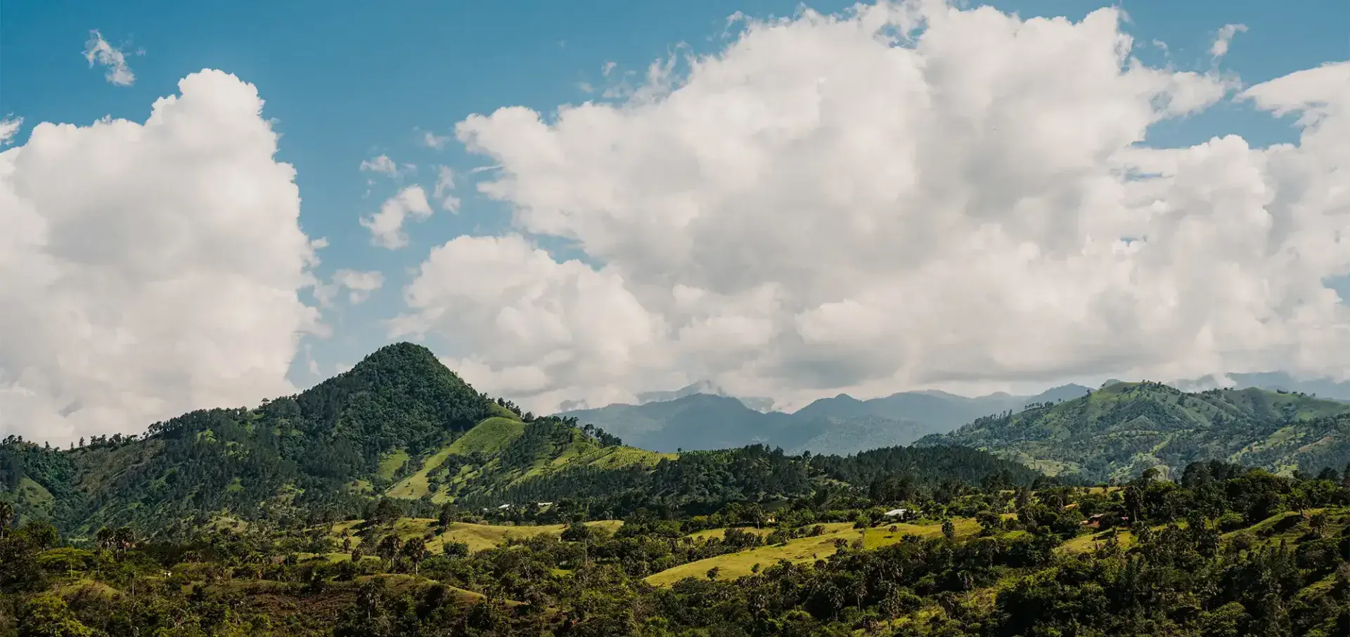 Mountain side view with white clouds