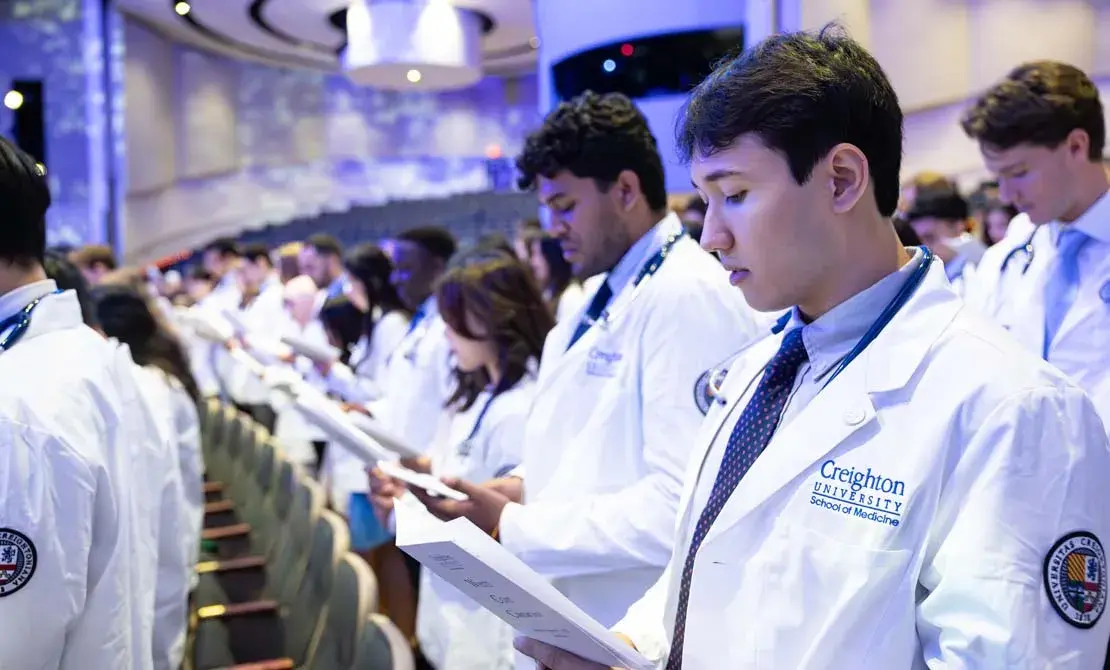 Phoenix white coat students at ceremony.