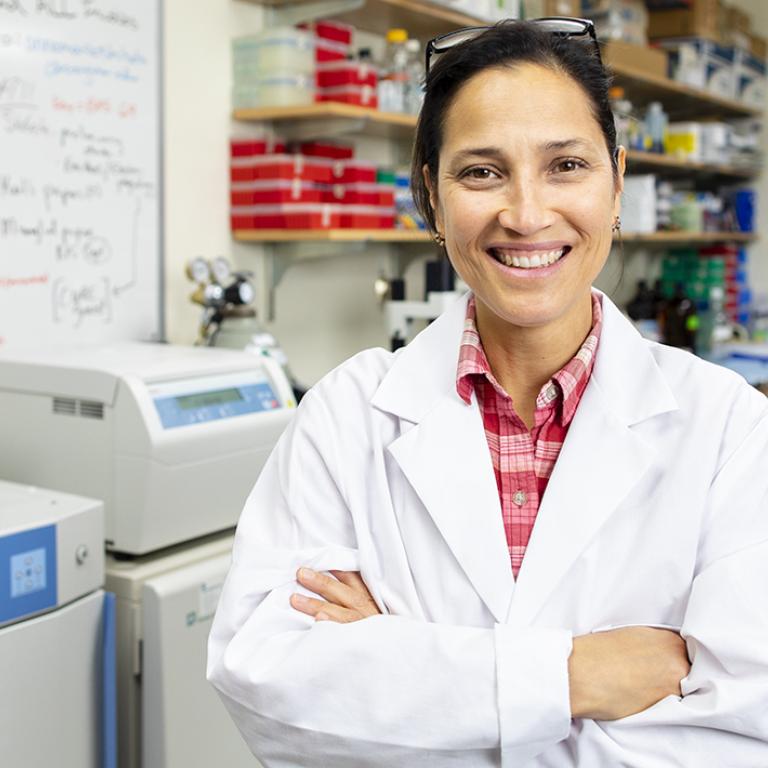Annemarie Shibata, PhD, poses in her research lab