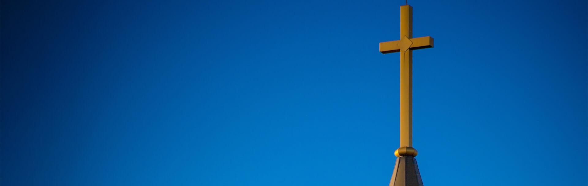 Steeple of St. John's Church against a bright blue sky