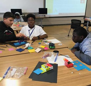 Young men Upward Bound students participating in a design thinking challenge