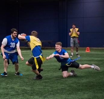 Students playing flag football at the Rasmussen Center
