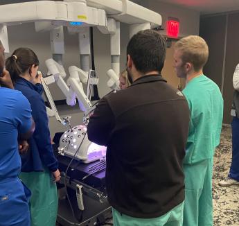 students observing robotic surgery