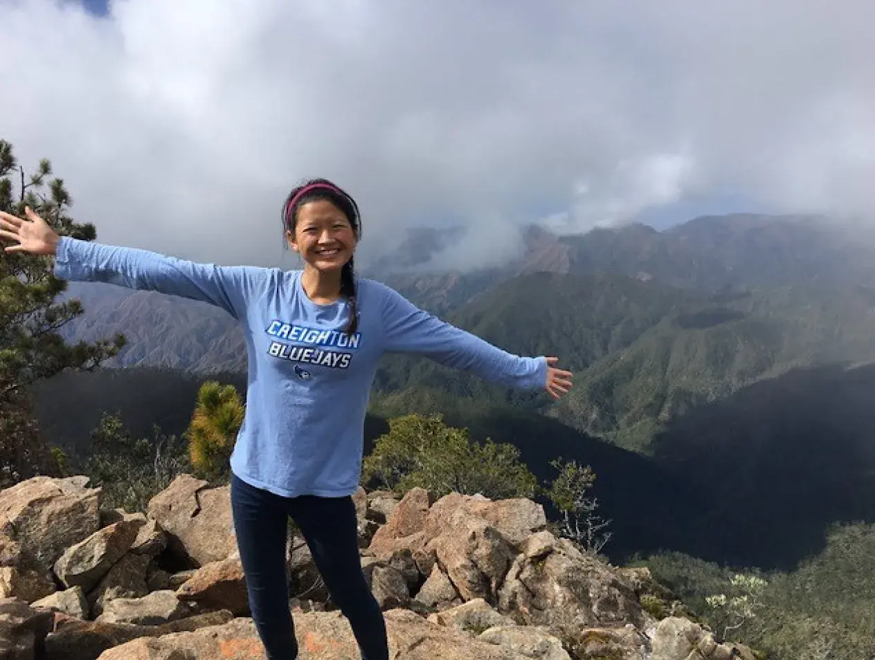 Creighton female student posing and having fun in Dominican rural hills.