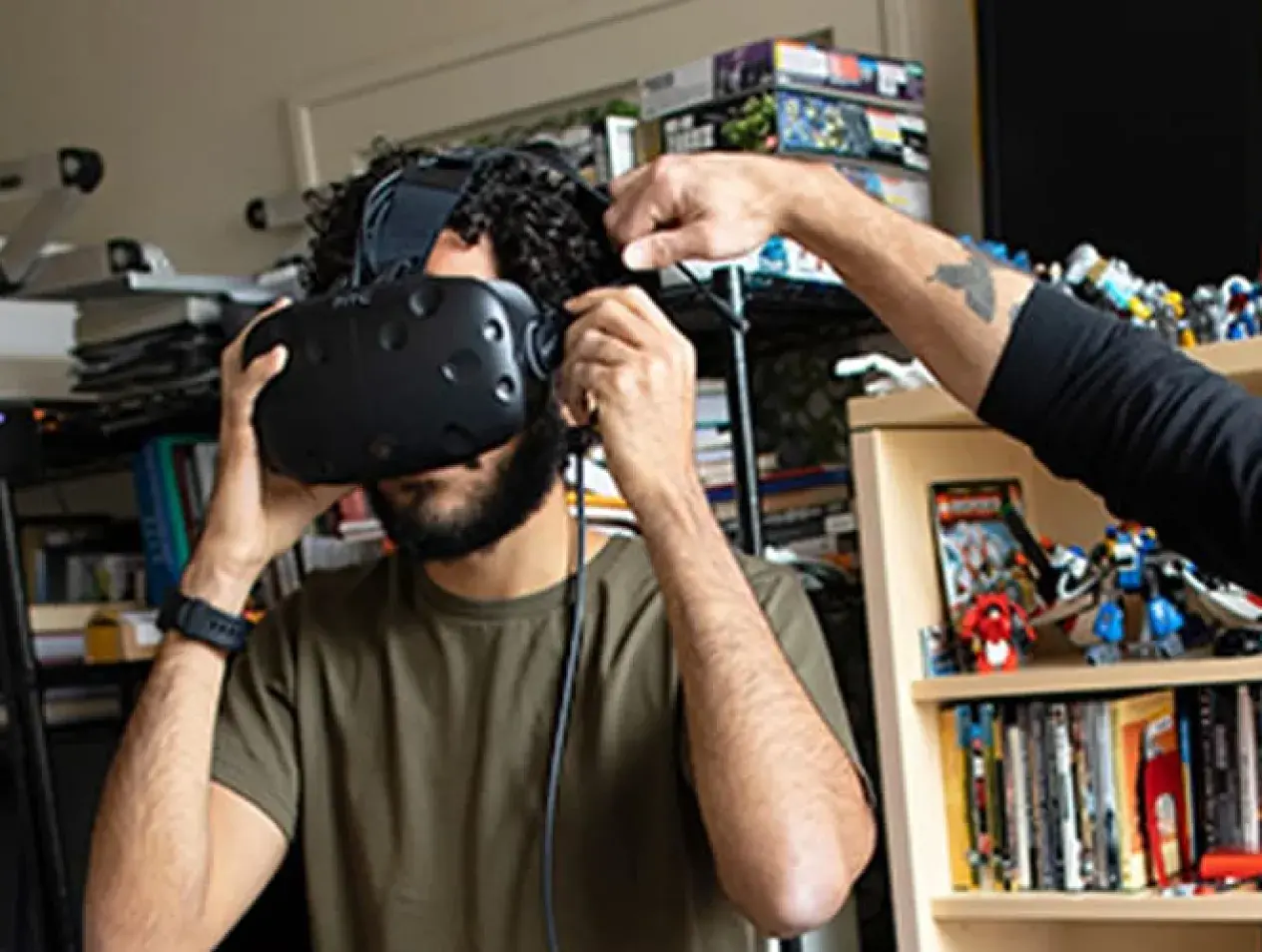 Faculty and student working together with VR headset