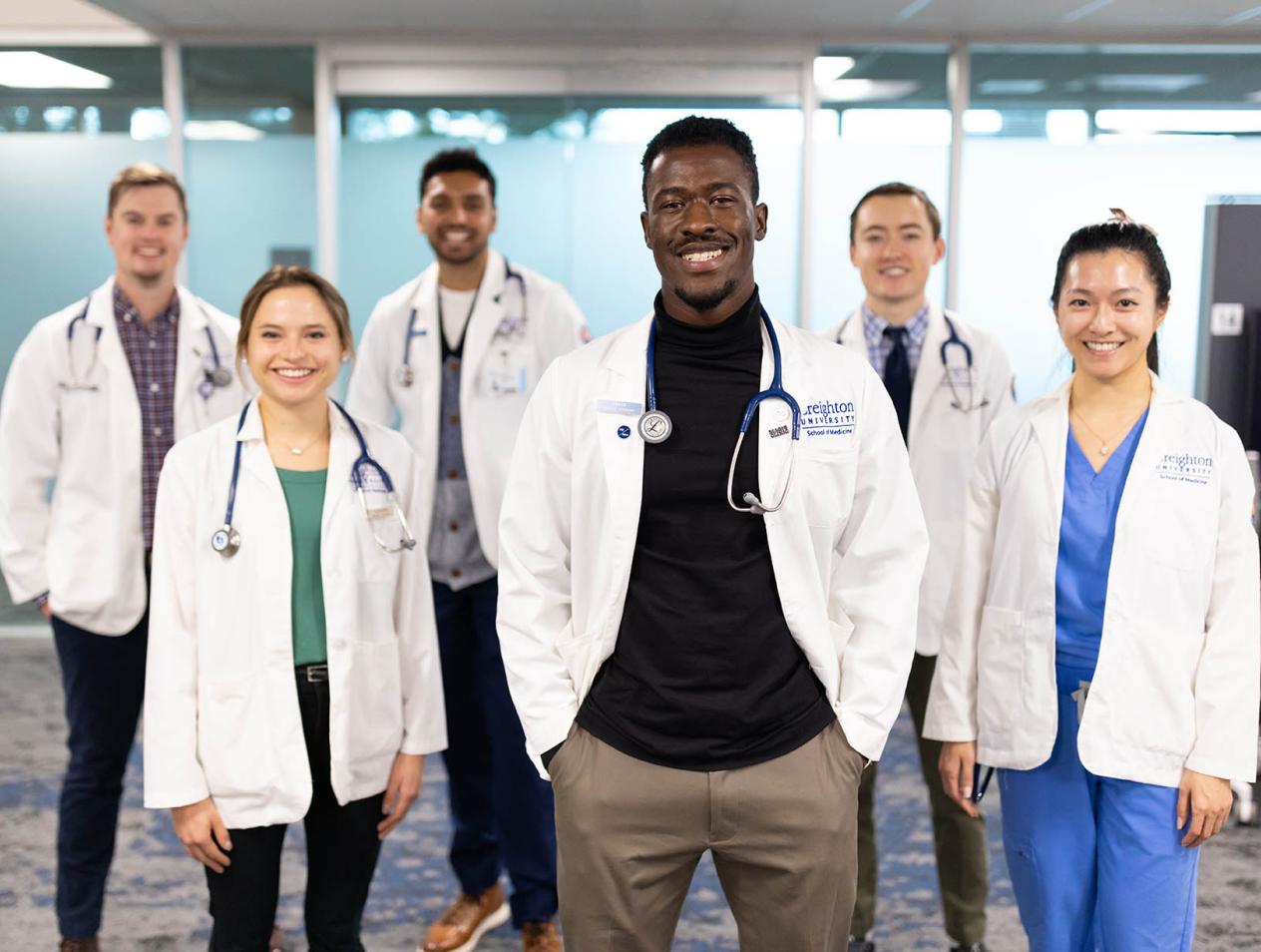 diverse group of creighton school of medicine medical students standing