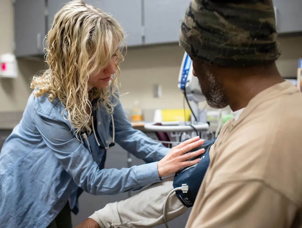 Nurse taking patient blood pressure